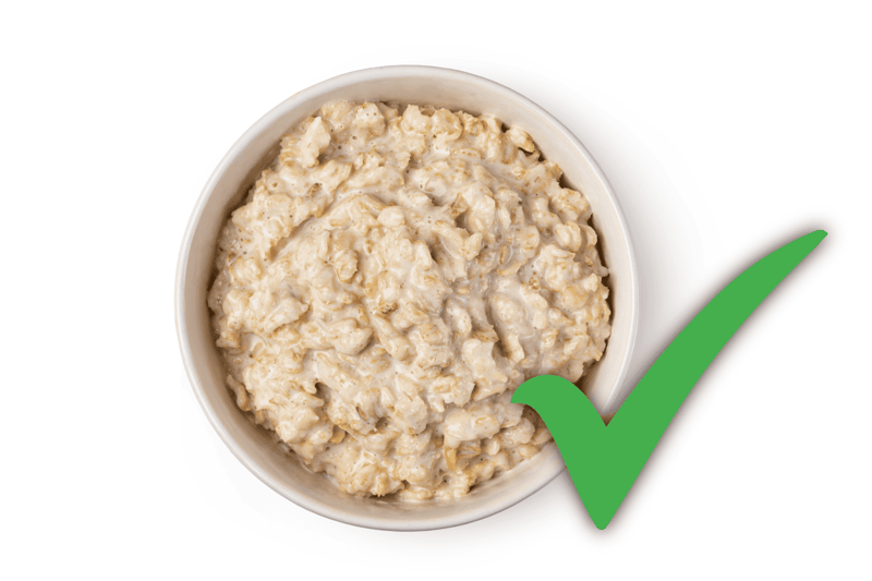 Dog food bowl filled with nutritious oatmeal and rice for dogs, promoting healthy diet and pet wellness.