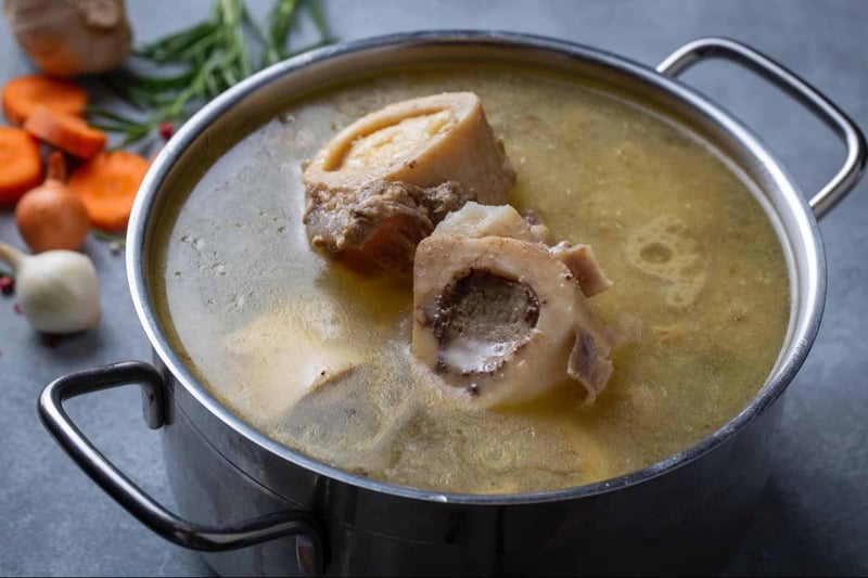 Delicious homemade beef bone broth with vegetables, perfect for nourishing your dog’s health.