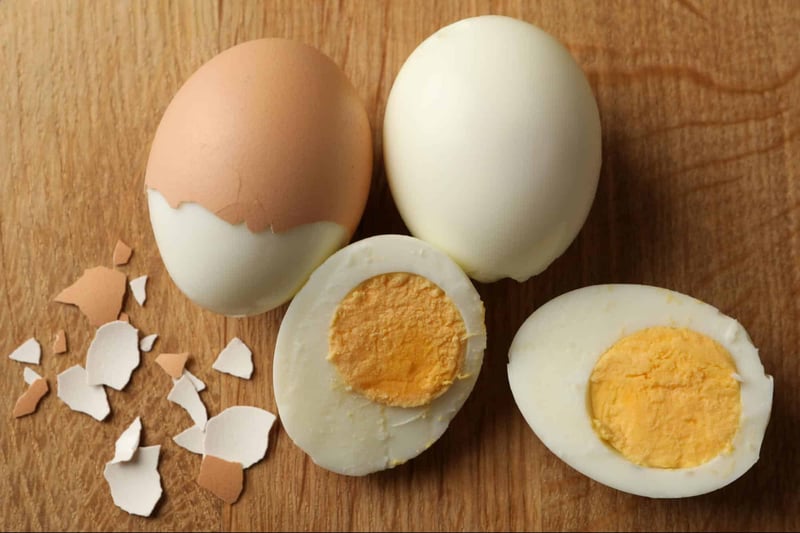 Alt text: Bowls of sliced and halved hard-boiled eggs garnished with parsley.