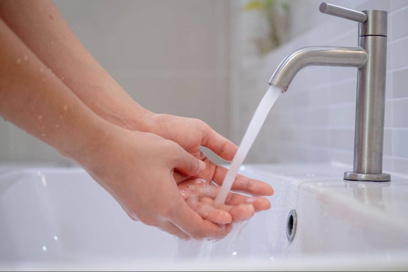 Efficient hand washing demonstration for proper hygiene and infection prevention.