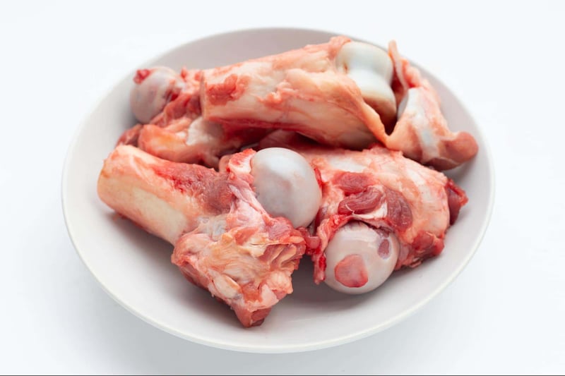 Dog bones and chews for dogs on white background.