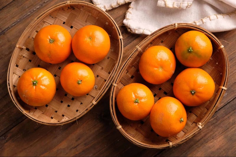 Bright fresh oranges in small woven baskets, perfect for healthy snacks and fruit baskets.