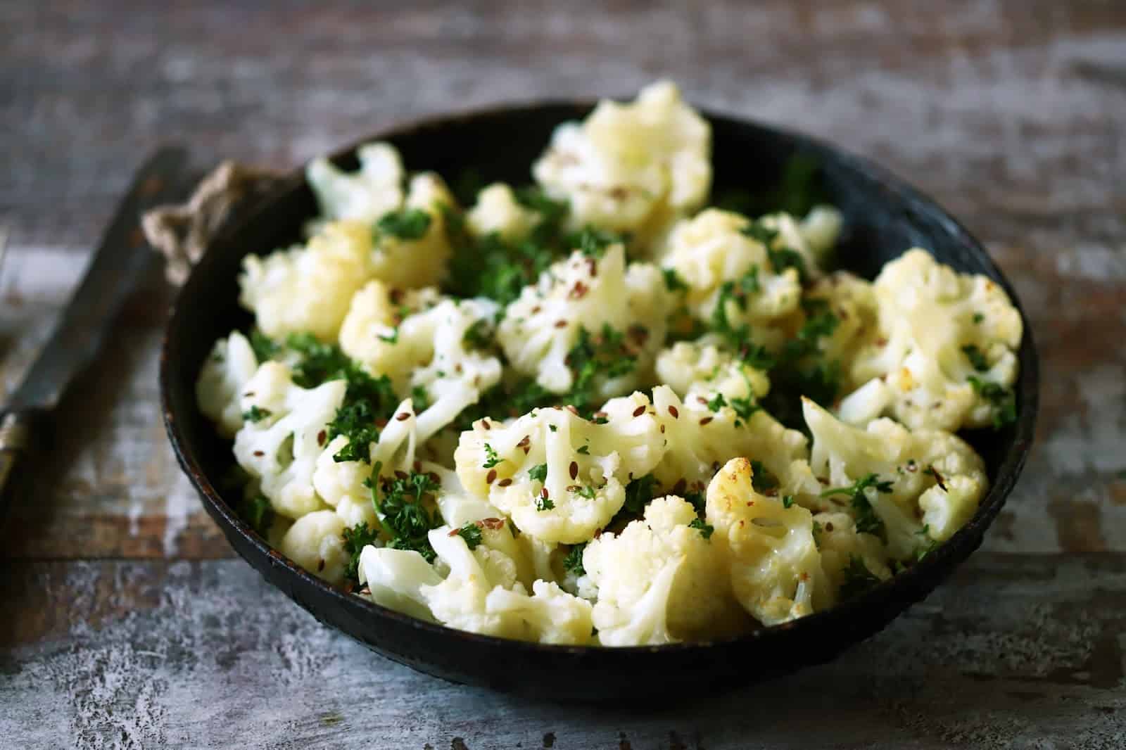 Healthy homemade cauliflower dog treats garnished with parsley. Perfect for nutritious, vet-approved canine snacks.