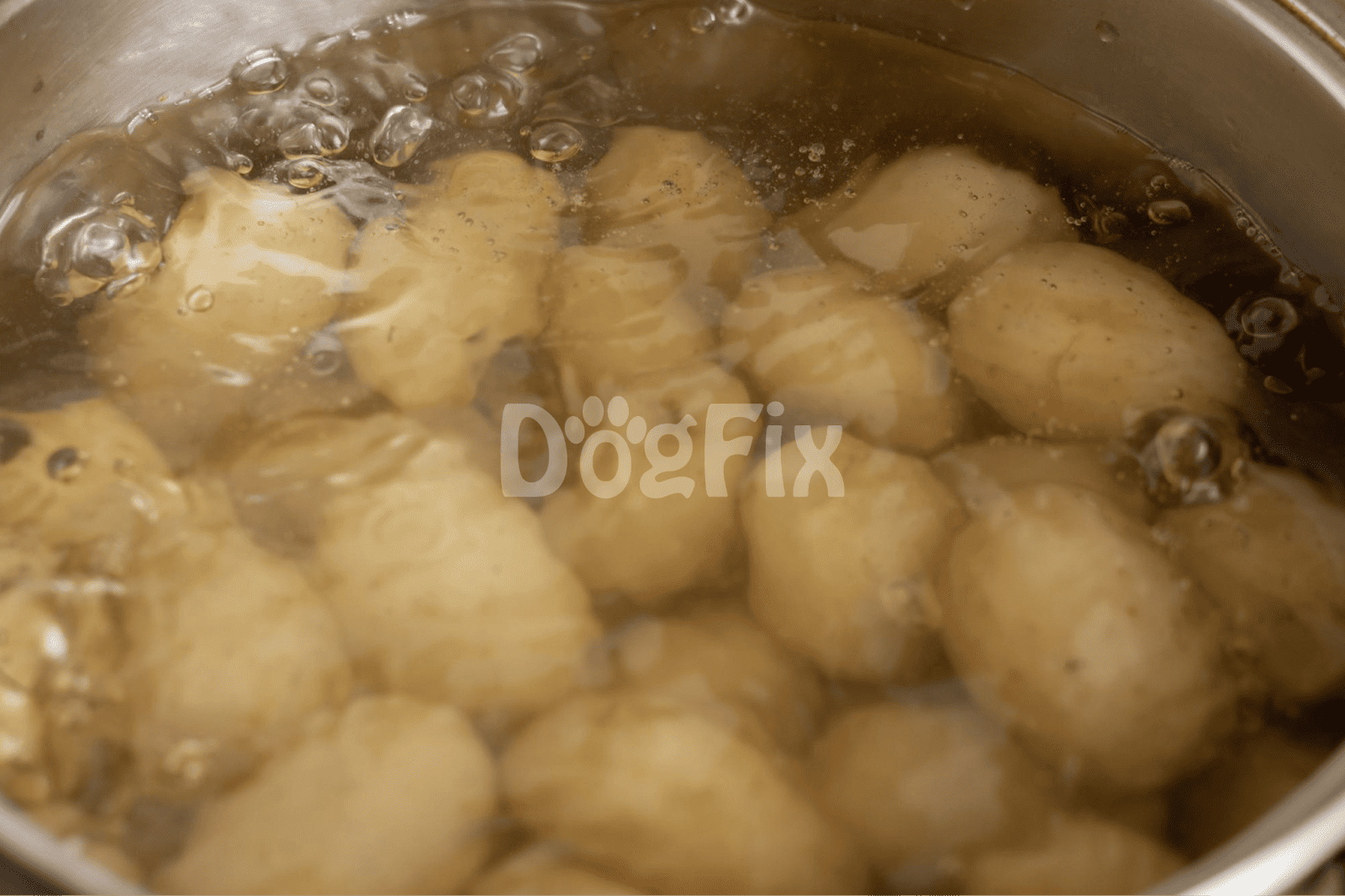 Close-up of potatoes boiling in a stainless-steel pot, ideal for preparing healthy dog food recipes.