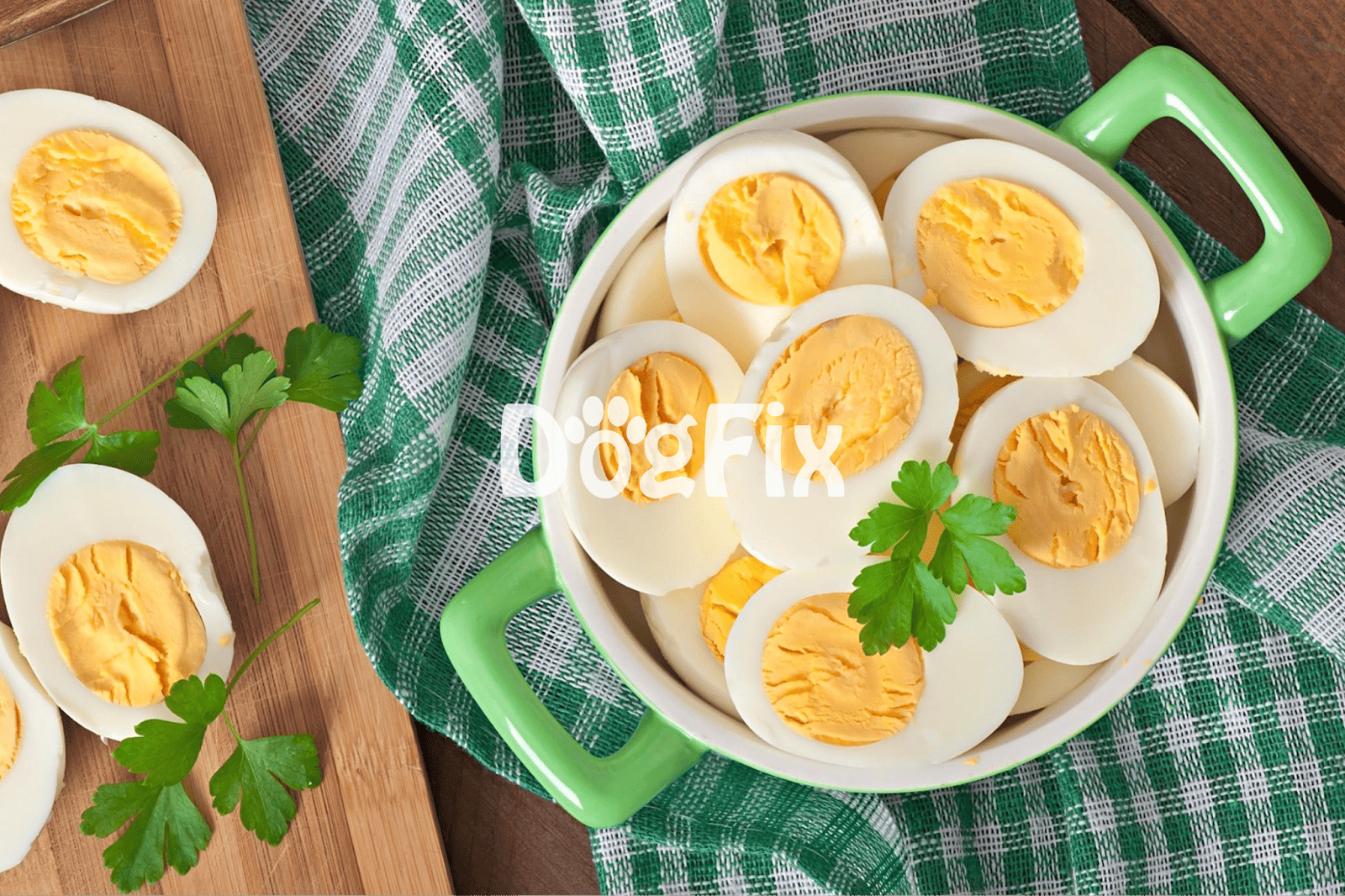 Alt text: Sliced boiled eggs in a green bowl with parsley, on a checkered cloth.