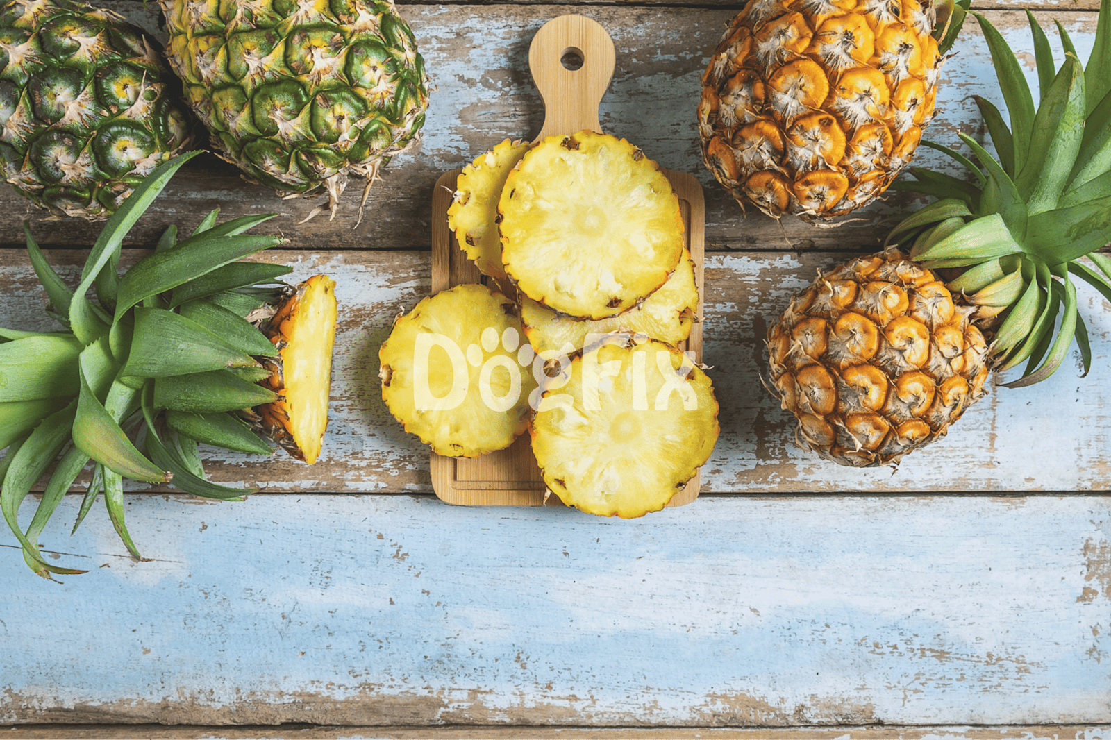 Fresh pineapples on wooden background suitable for nutritious dog treats.