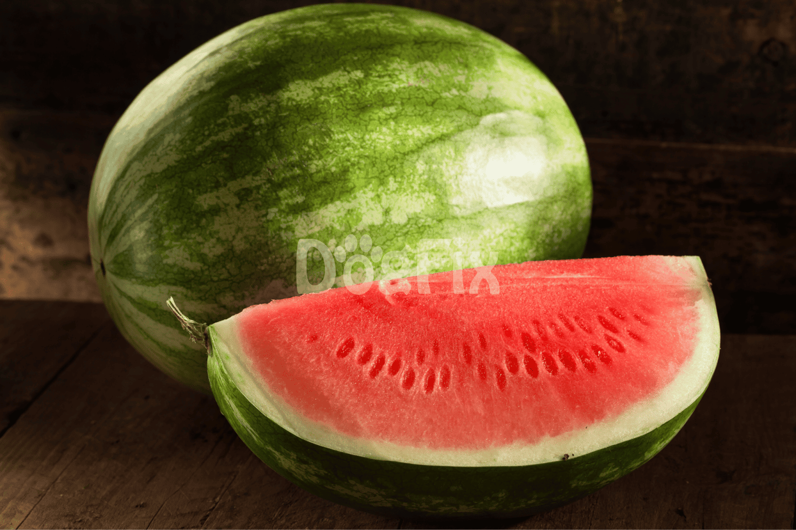 Close-up of a sliced juicy watermelon on rustic wooden surface.