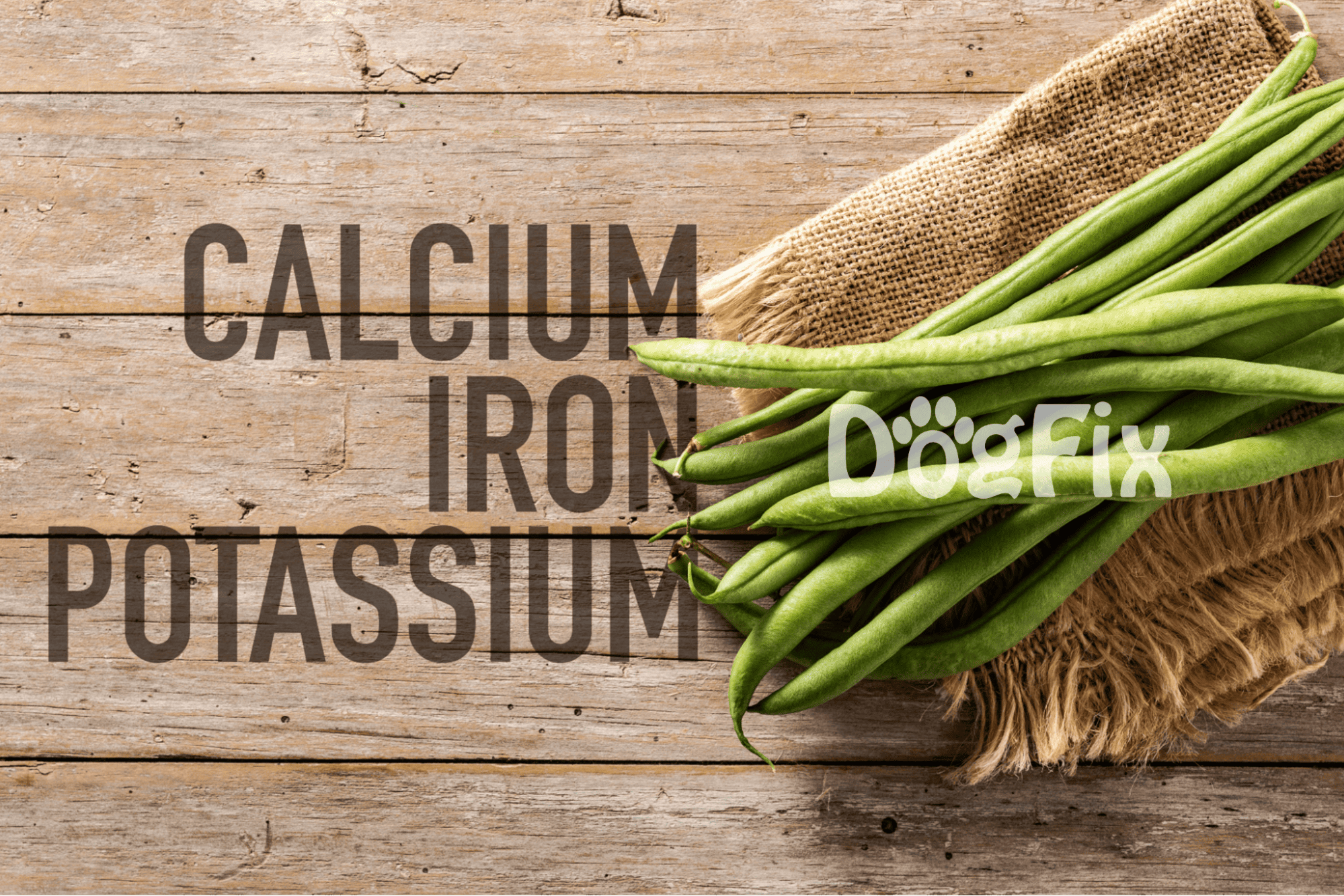 Fresh green beans spilling out of a burlap sack on a wooden surface.