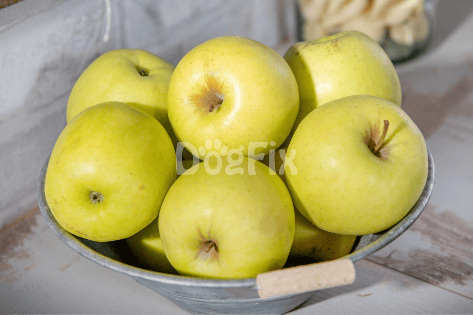 Bright yellow-green apples in a bowl, perfect for healthy snacks or cooking.