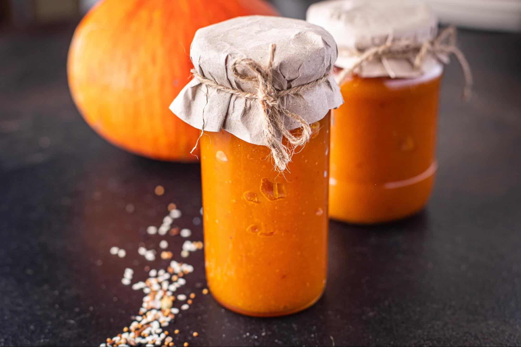Delicious homemade pumpkin puree in glass jars, perfect for fall recipes and pet treats.