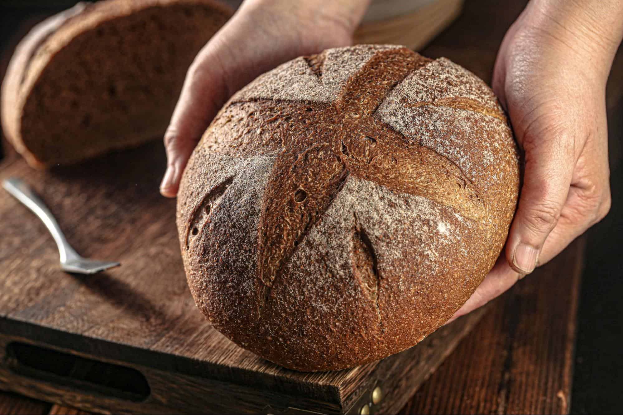 Artisan sourdough bread with crispy crust and flour dusting, perfect for a healthy diet.