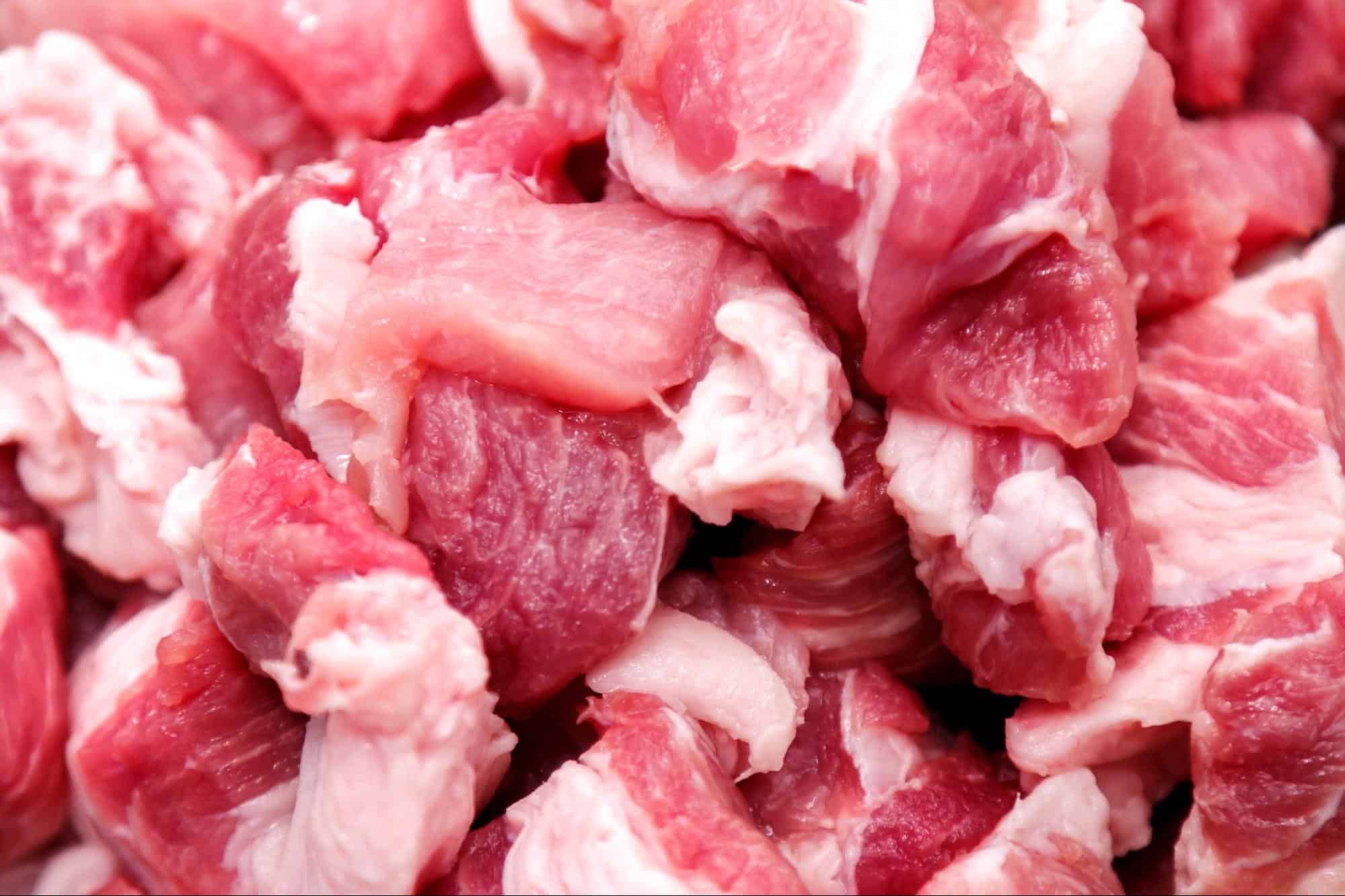 Close-up of raw, chopped meat perfect for pet diets and dog food supplements.