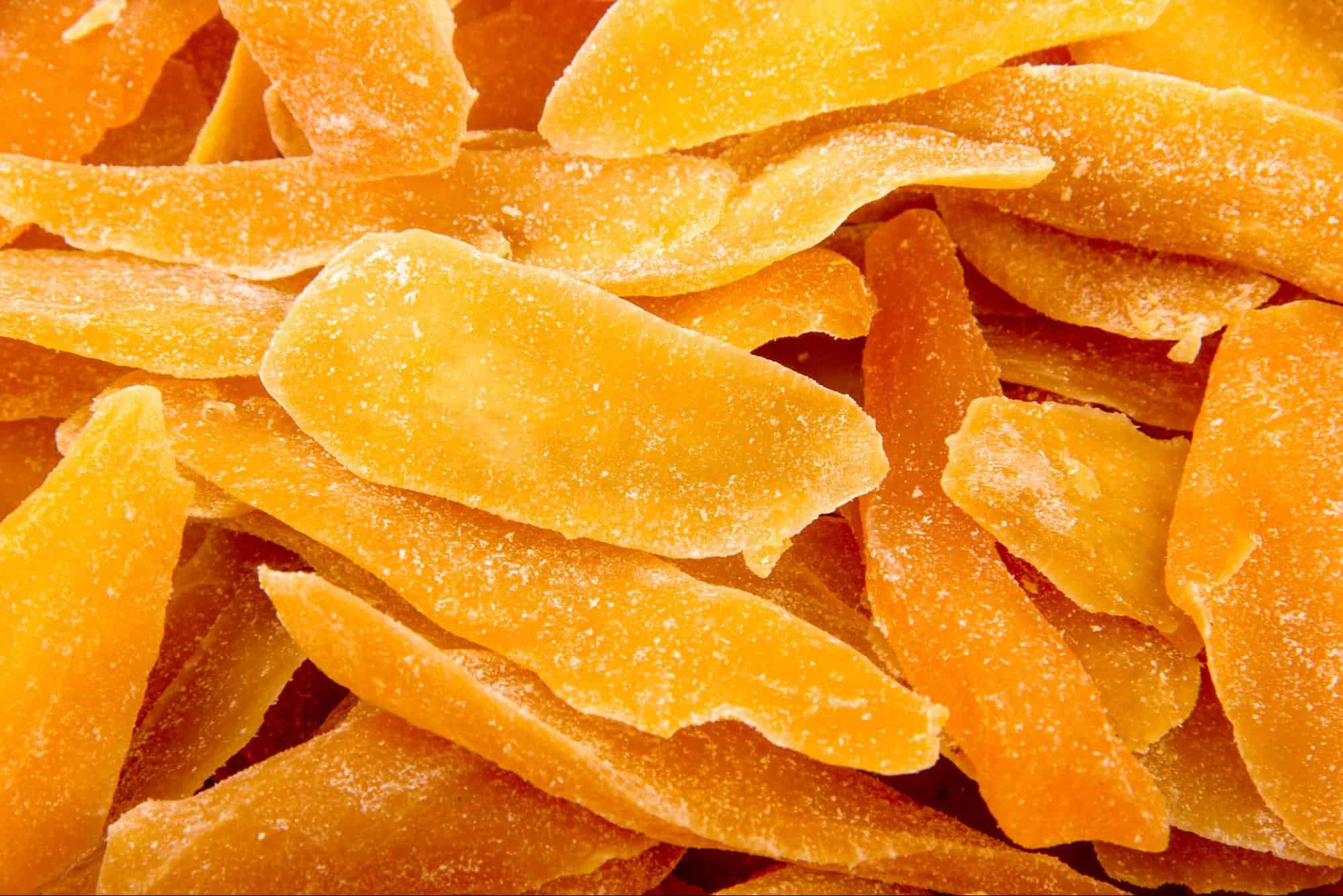Fresh dried mango slices for dogs, healthy and tasty dog treats, natural snacks for pets.