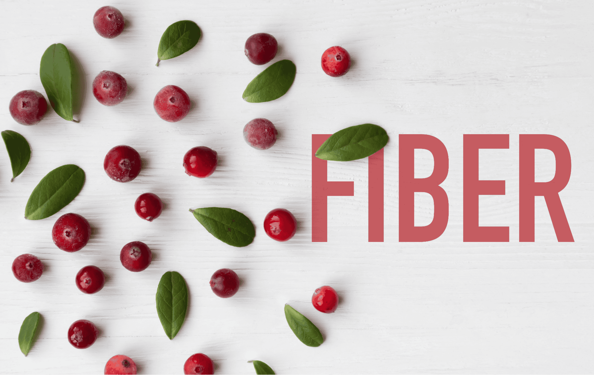 Fresh cranberries and green leaves on white wooden background enhancing dog health and nutrition.