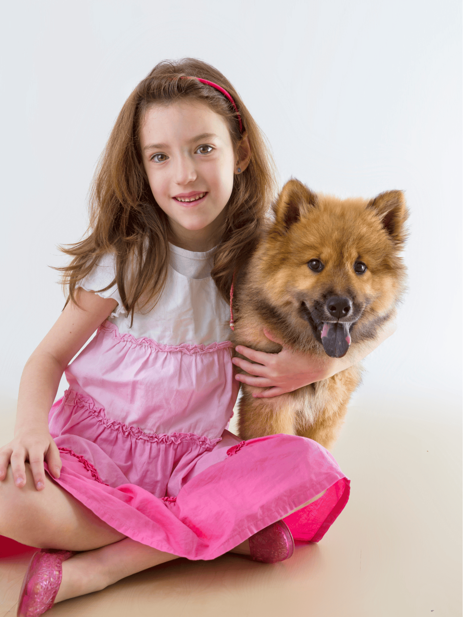 Girl and adorable fluffy dog, enjoying pet companionship, happy moments.