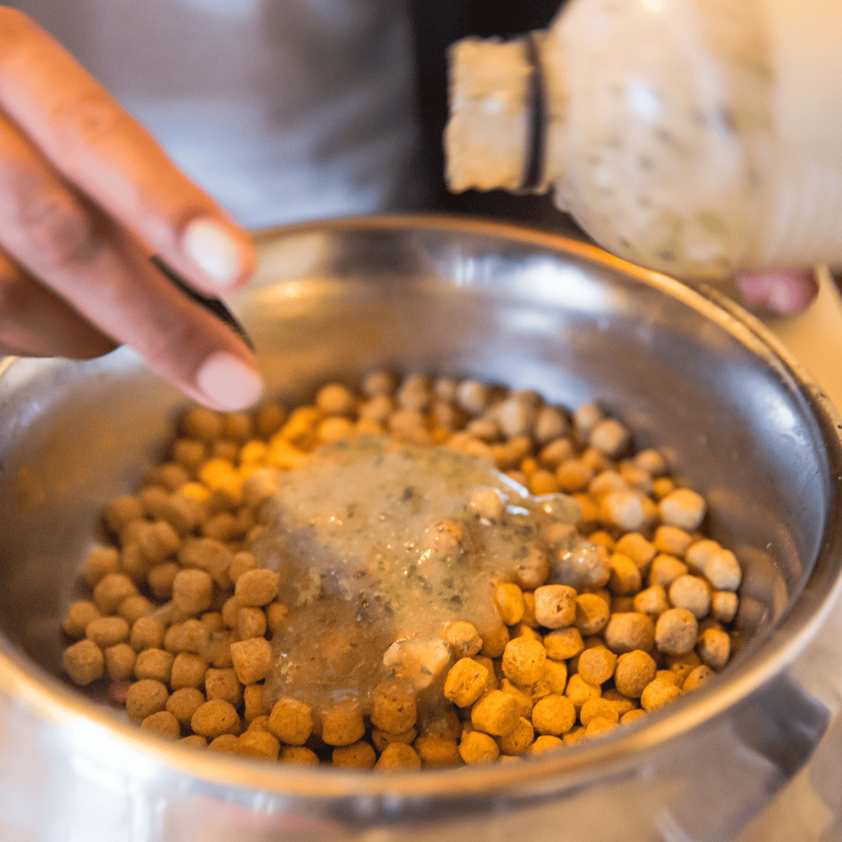 High-quality dog food being prepared with nutritious ingredients for pets.