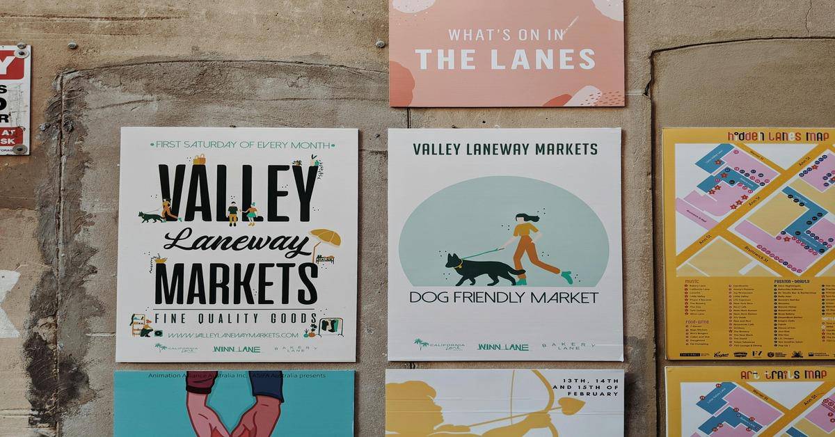 Bright Valley Markets sign promoting local market events, dog-friendly, with clear details and colorful design.