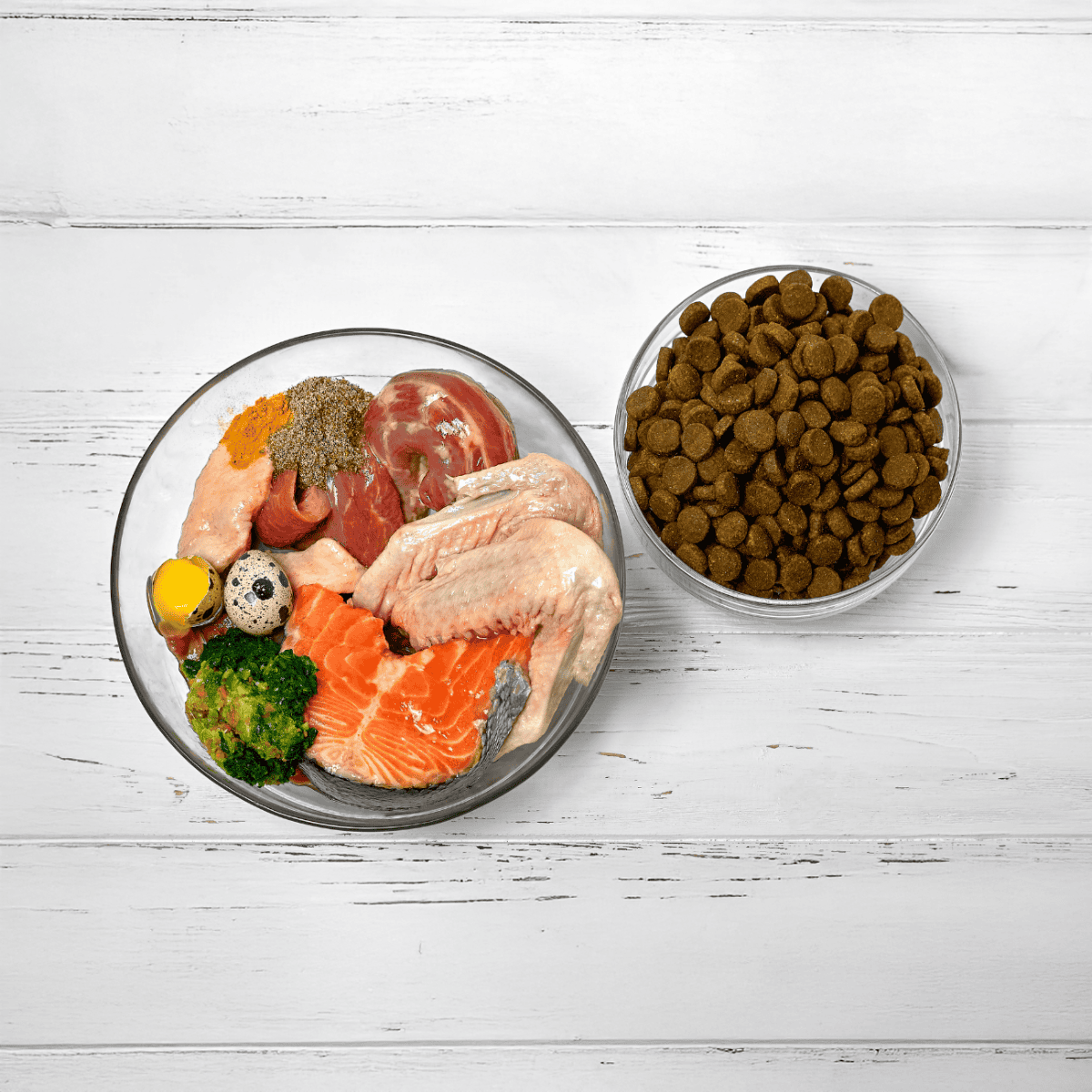 High-quality raw dog food ingredients, including meat, fish, vegetables, and kibble for healthy pups.