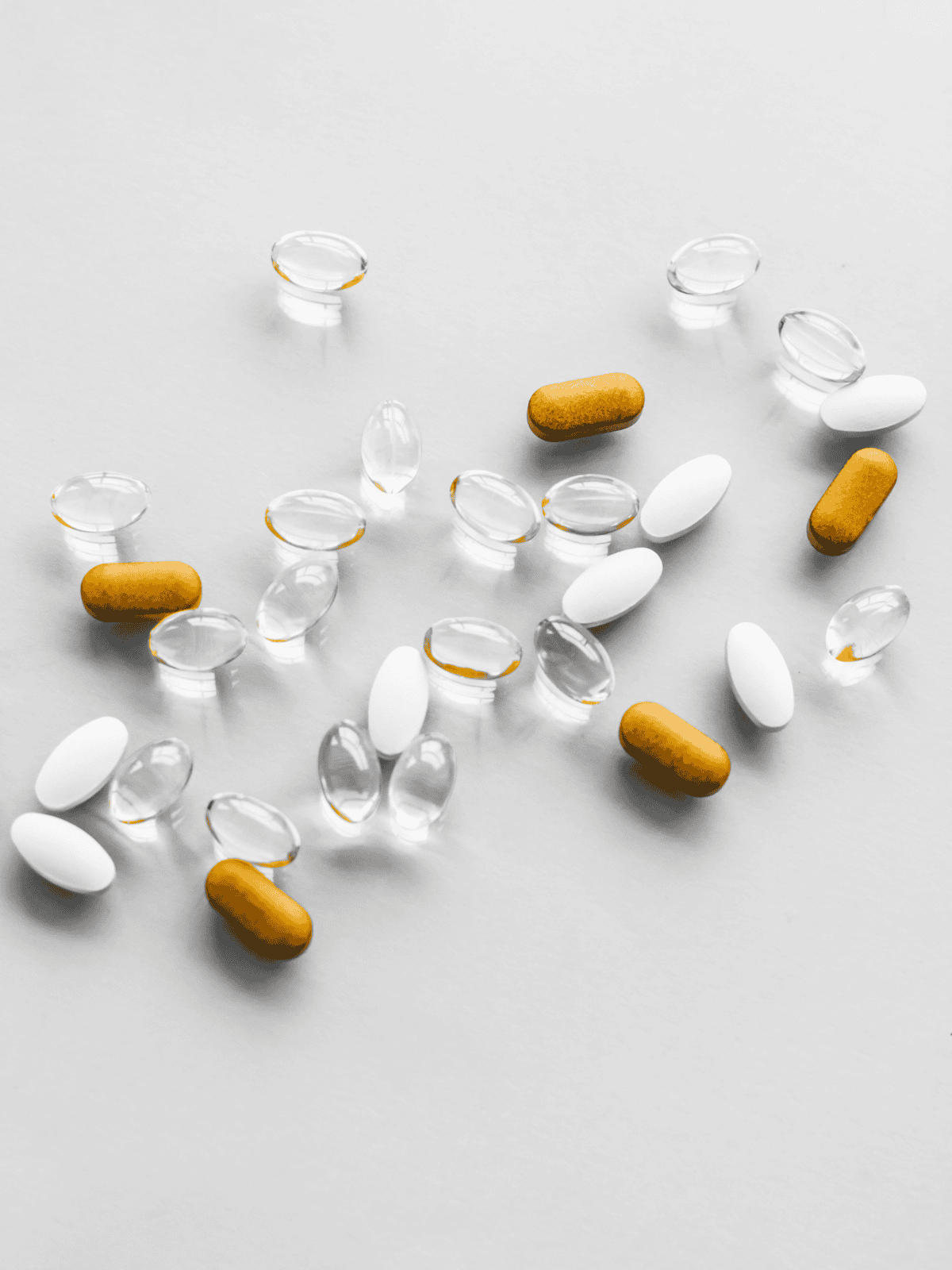 Dog supplement pills and capsules on a white background.