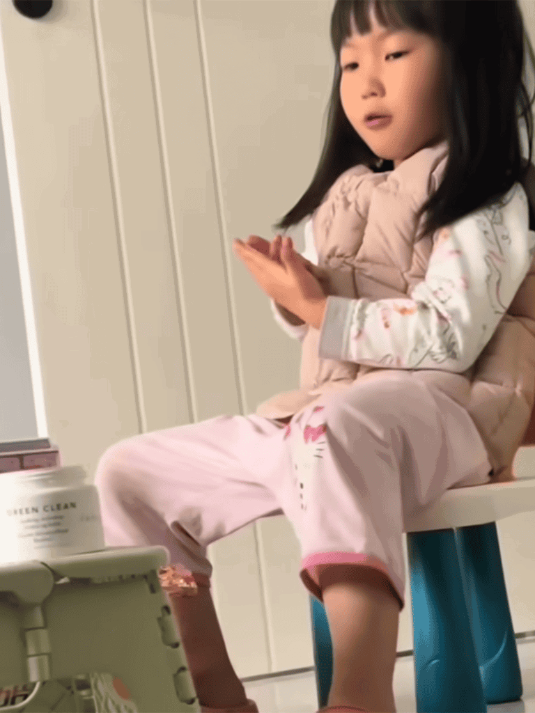 Child relaxing at home with a pet care station, emphasizing home pet grooming and relaxation.